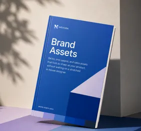 Blue Brand Assets booklet standing on a purple surface